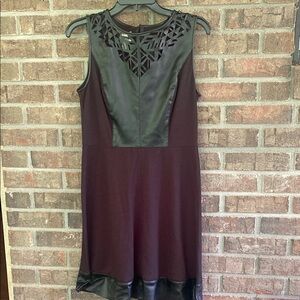 Elegant Black Sleeveless Dress with Leather Accents